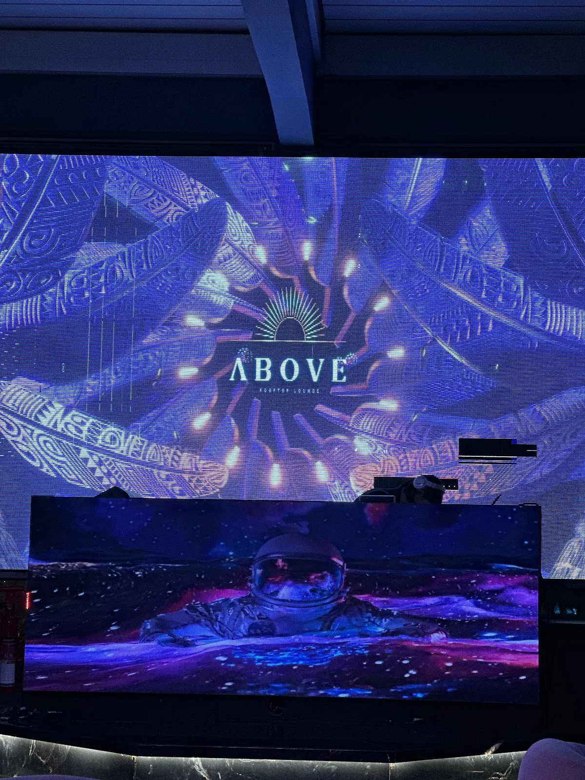 DJ booth in front of a digital LED backdrop