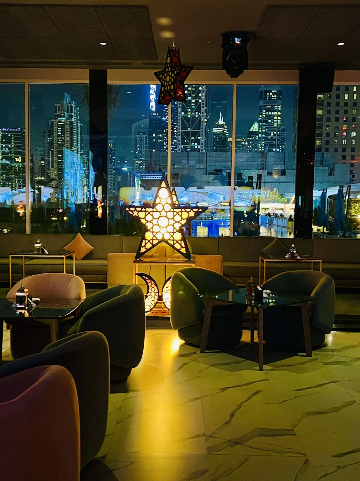 Indoor lounge seating facing the Downtown Dubai skyline